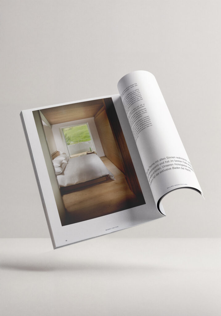 Aufgeschlagenes Magazin Wensky Edition mit exklusivem Schlafzimmer-Interieur aus Holz und Blick ins Grüne für luxuriöse Immobilien in Mannheim.